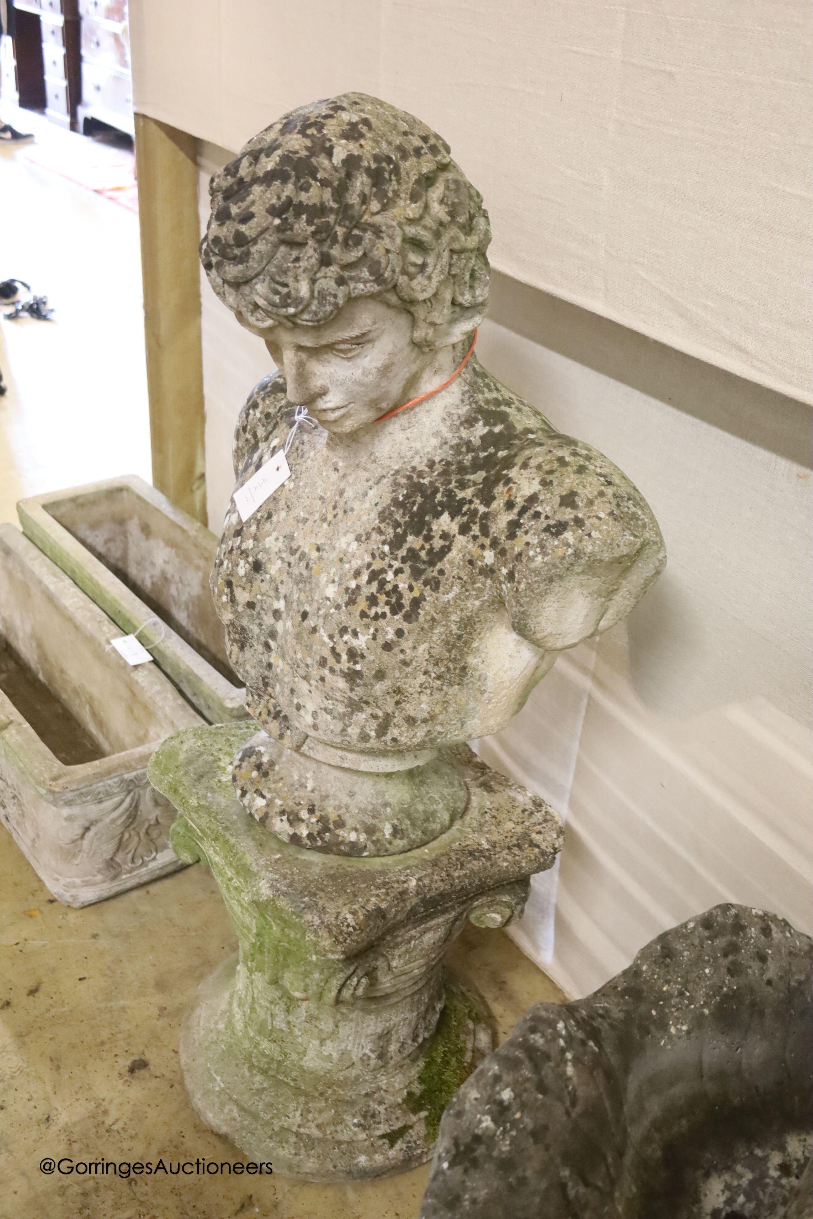 A reconstituted stone classical bust on pedestal, height 108cm